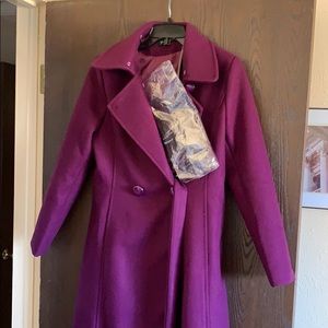 Knee length purple wool coat with fur collar.